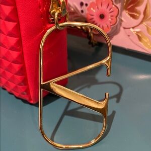 Valentino Garavani Red Cosmetic Bag with Gold Accents